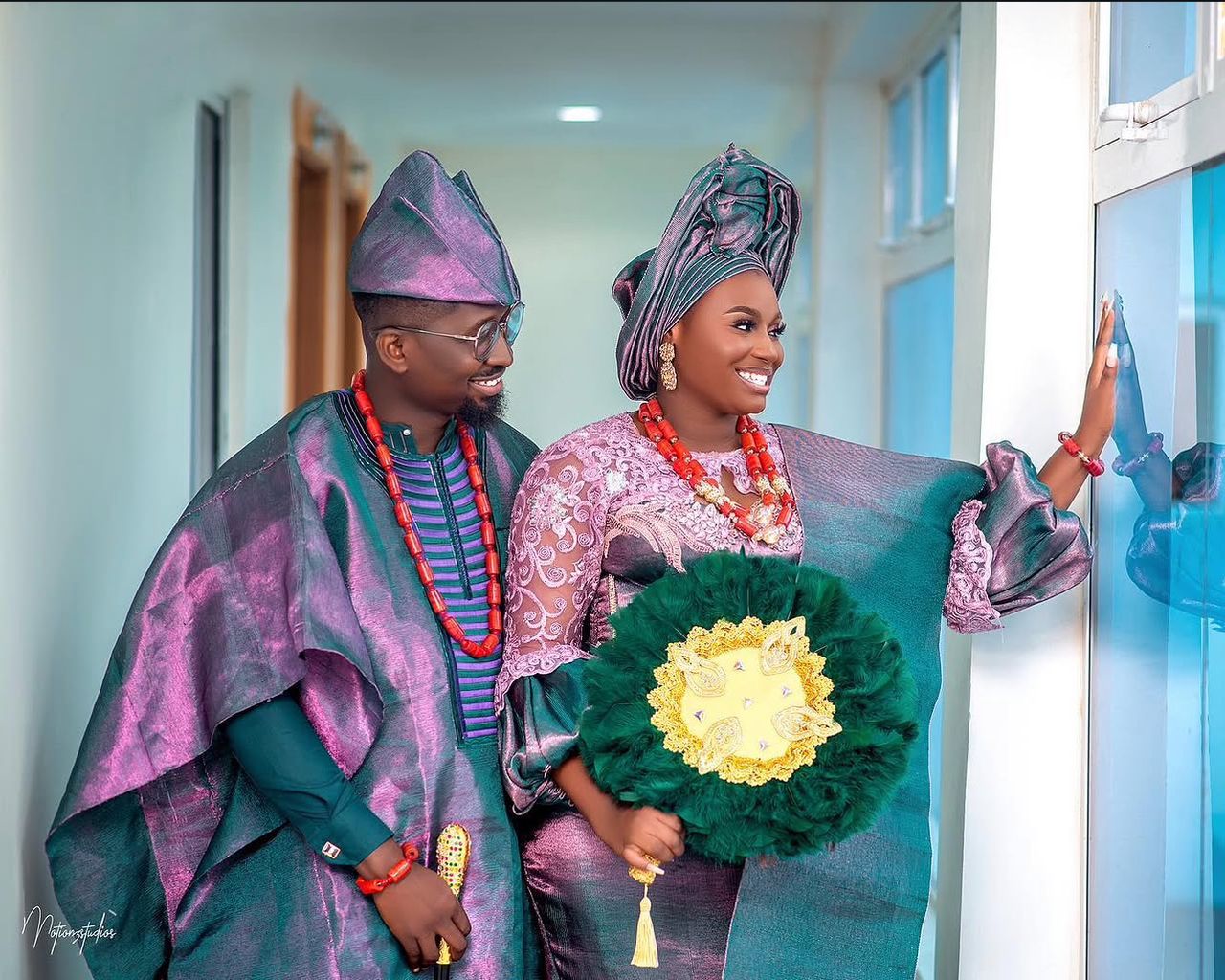 Traditional Nigerian couple in aso-oke with coral beads
