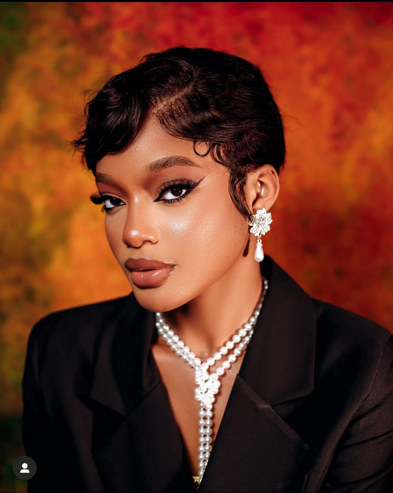 Portrait with pearl drop earrings and layered pearl necklace